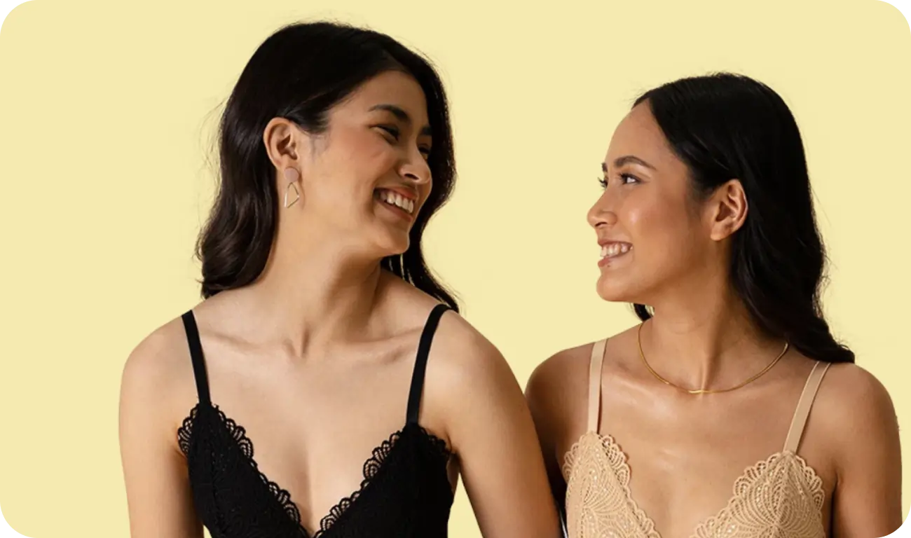 women looking at each other and smiling