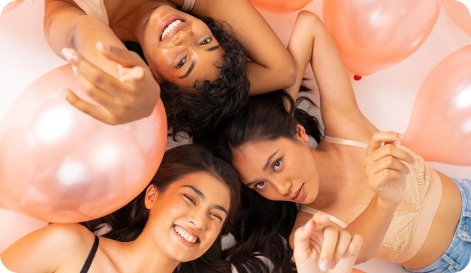 three women posing for Soko