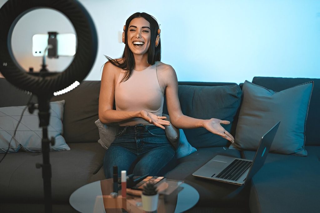 Female influencer vlogging online with smartphone